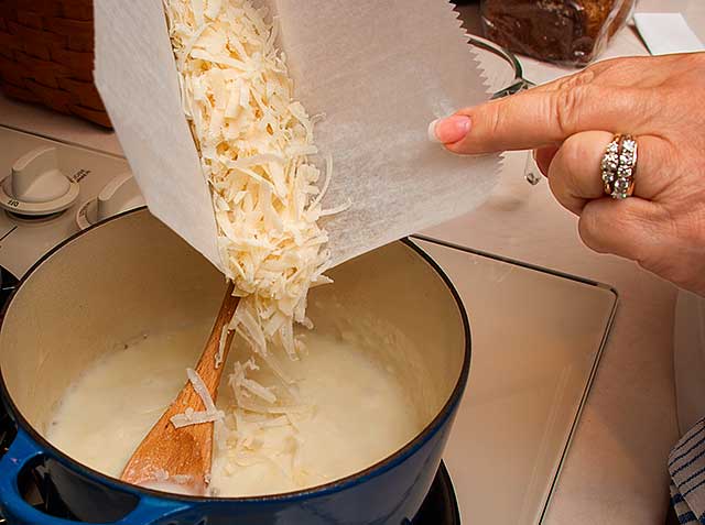 Adding cheese to the sauce